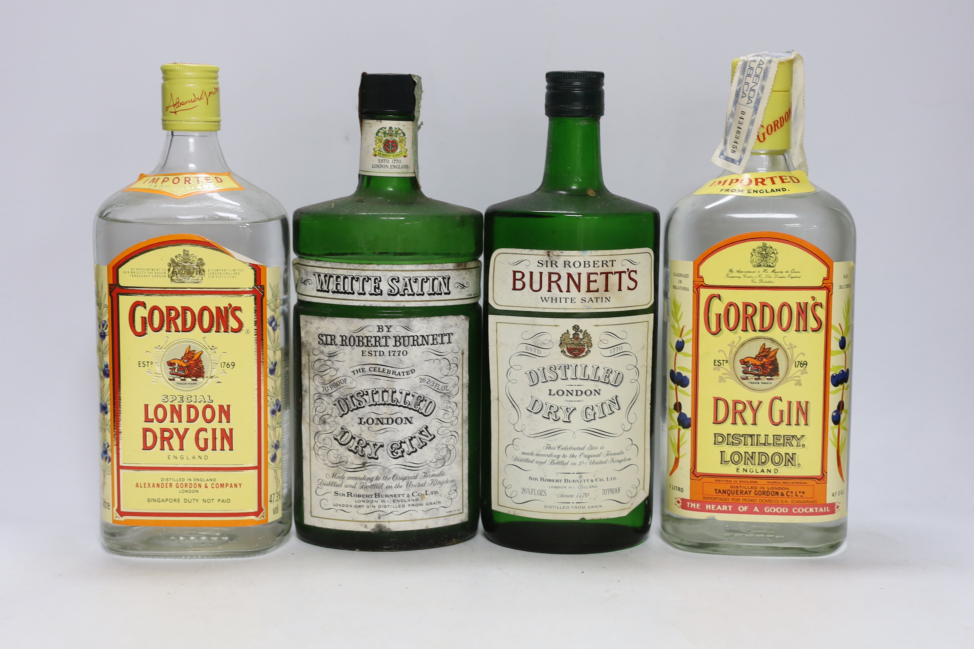 Eight and a half bottles of gin; Gordons, White Satin and Burnetts